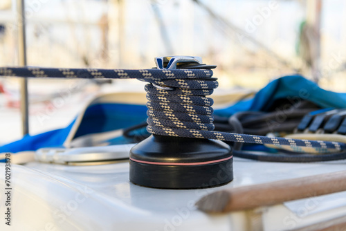 Yacht winch with rope on sailing boat. Yachting concept.