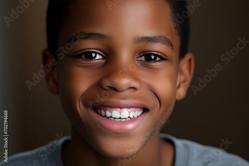 Adorable black boy shows off his perfect smile after wearing braces