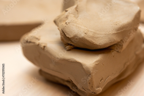 Wallpaper Mural a piece of clay on a light background, for making clay products Torontodigital.ca