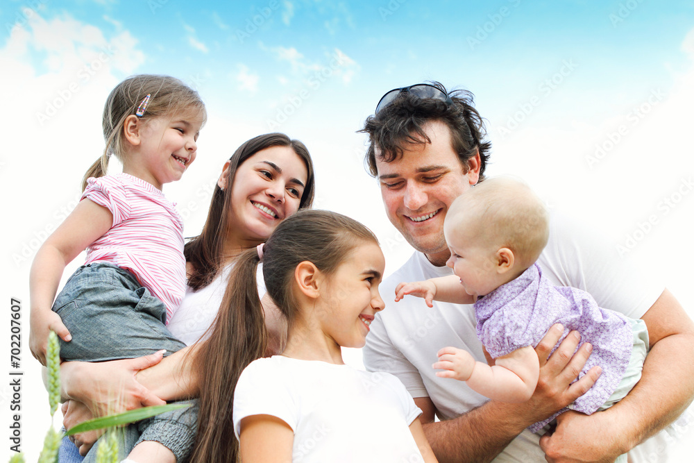 Cheerful happy family in wheat field Cheerful happy family in wheat field