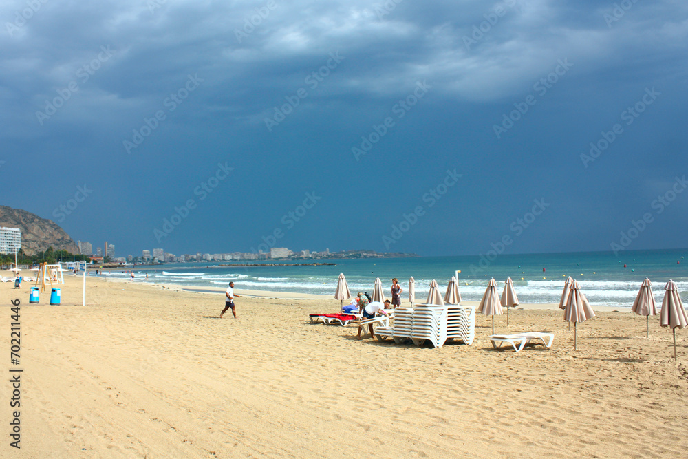 Scenic view of blue sea and beach at rainy day in Alicante, Spain