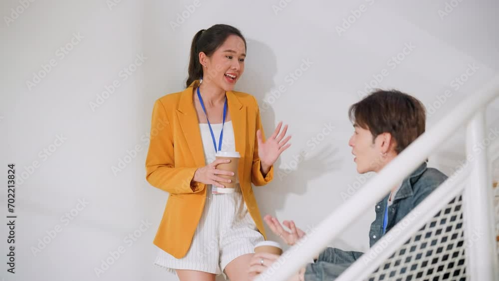 casual relax cinversation in break time two busness male and female person creative agent casual talking sanding on a stair after seminar business meeting in modern office interior business concept casual relax cinversation in break time two busness male and female person creative agent casual talking sanding on a stair after seminar business meeting in modern office interior business concept