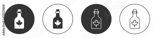 Black Bottle of maple syrup icon isolated on white background. Circle button. Vector