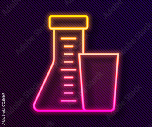 Glowing neon line Test tube and flask chemical laboratory test icon isolated on black background. Laboratory glassware sign.  Vector