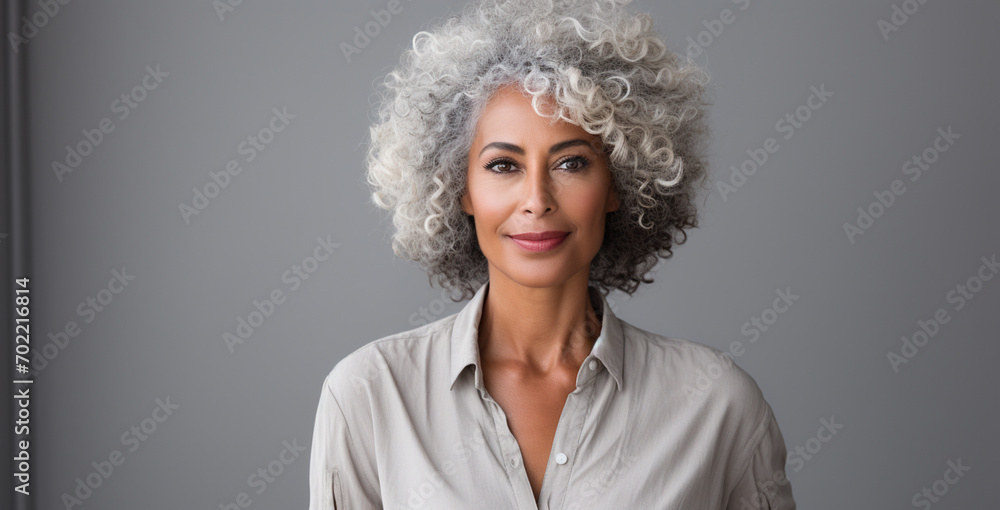 Portrait of beautiful woman with ash hair color on background