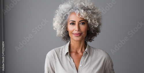 Portrait of beautiful woman with ash hair color on background photo