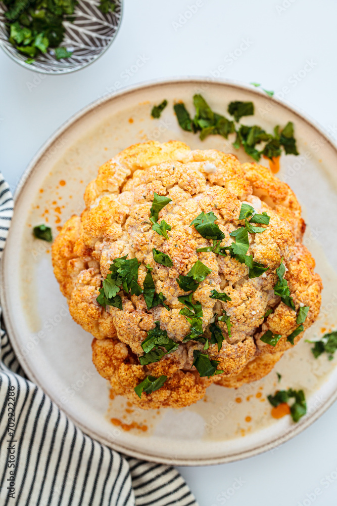 Whole cauliflower baked in spices and tahini dressing. Whole cauliflower baked in spices and tahini dressing.