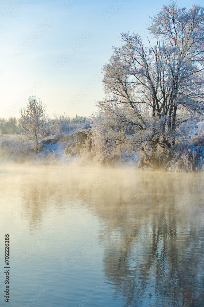 Experience the breathtaking beauty of the frozen river at sunrise. Witness the works of nature: shimmering frost creates a mesmerizing spectacle. Immerse yourself in the glory of Frozen Beauty Sunrise
