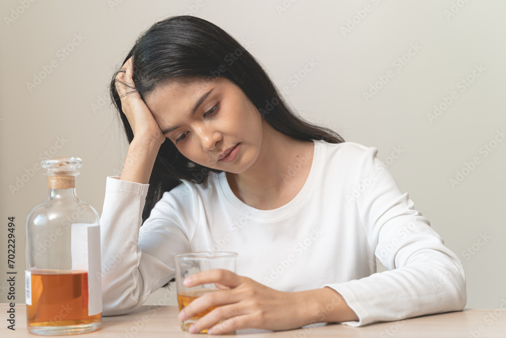 depression and anxiety woman drinking whisky alone. depression and anxiety woman drinking whisky alone.