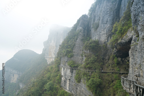 There is a path on the bare mountain wall. Characteristics of karst landforms. Jinfo Mountain karst topography, biodiversity and Buddhist culture, Chongging. photo