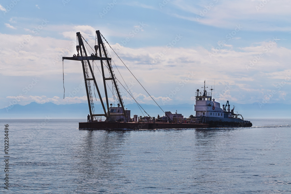 Floating crane as water industrial transport.