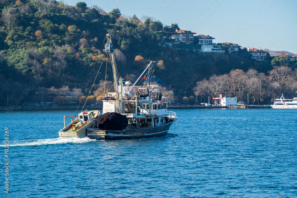 Fishing boat is traveling on Bosphorus in Istanbul
