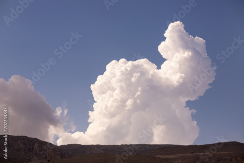 White clouds in the blue sky.