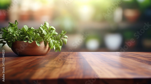 A bowl of fresh green basil leaves on a wooden tabletop with a bright blurred background.