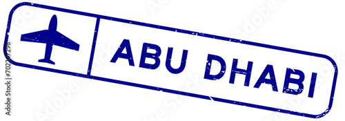 Grunge blue abu dhabi word with plane icon square rubber seal stamp on white background