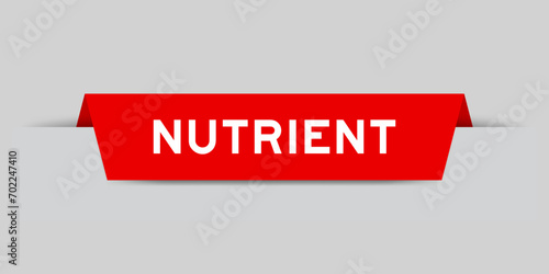 Red color inserted label with word nutrient on gray background