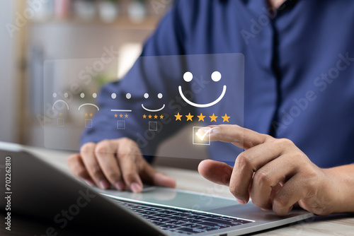 Online customer satisfaction survey feedback and ratings for business success, User give rating to service experience on online application, Quality service evaluation positive customer reviews. photo