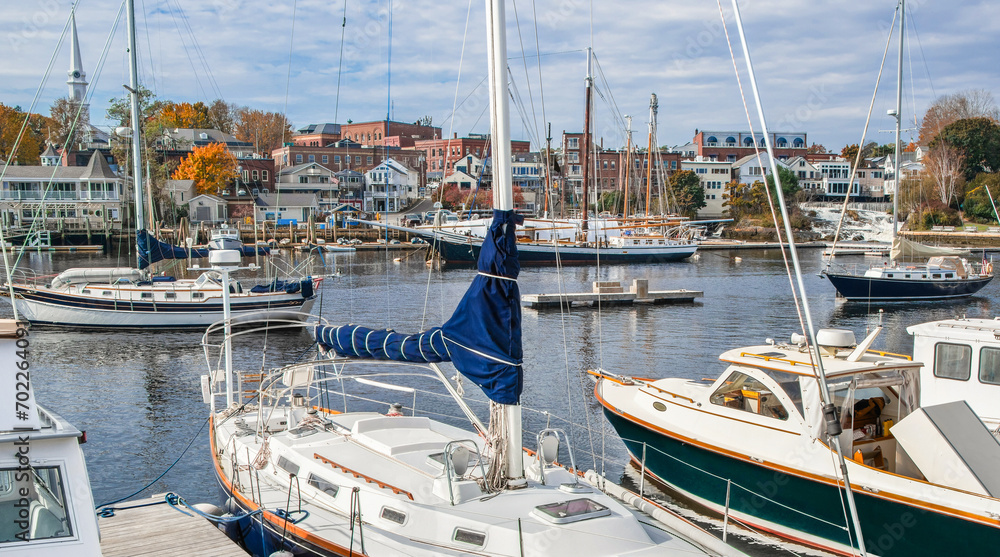 New England Harbor:  Yachts, fishing boats and sailing ships gather in Camden, Maine on an October afternoon.
