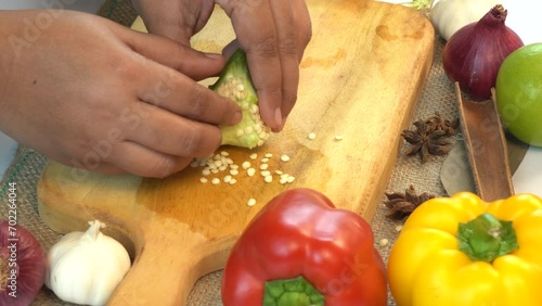 woman separated green pepper seed from pepper