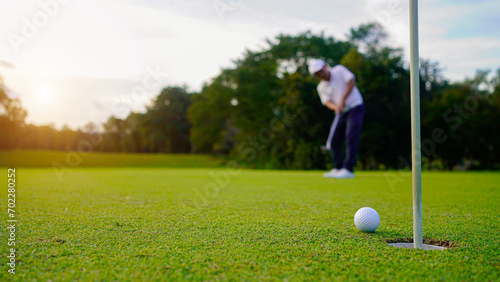 golfer playing golf in beautiful golf course in the evening golf course with sunshine