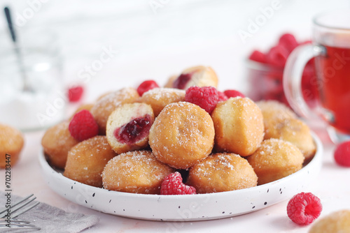 A plate wit traditional berliner cakes with jelly