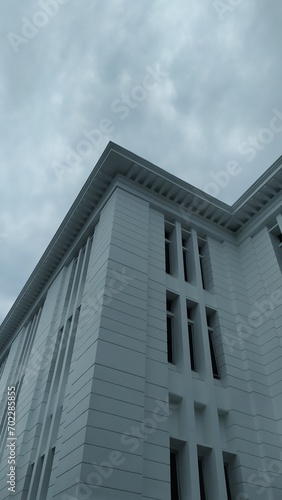 Modern Office Building with grey clouds
