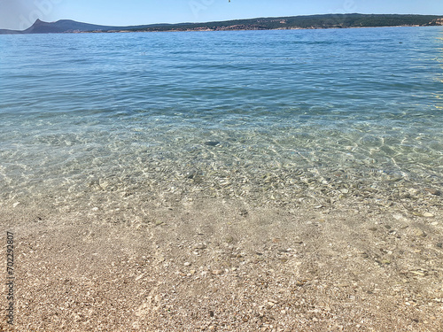 Beautiful seascape with clear sea water and sandy beach in summer © Lorenzo