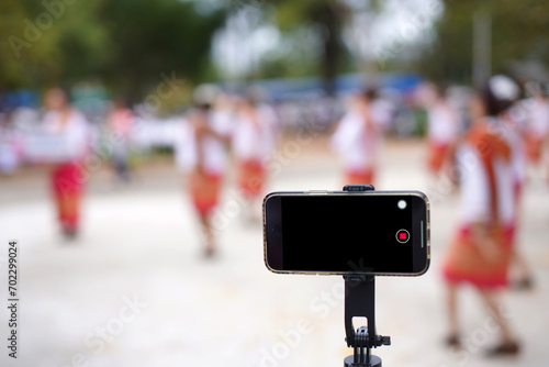 Mobile phone camera on a tripod technology concept Mobile phone broadcasts live programs