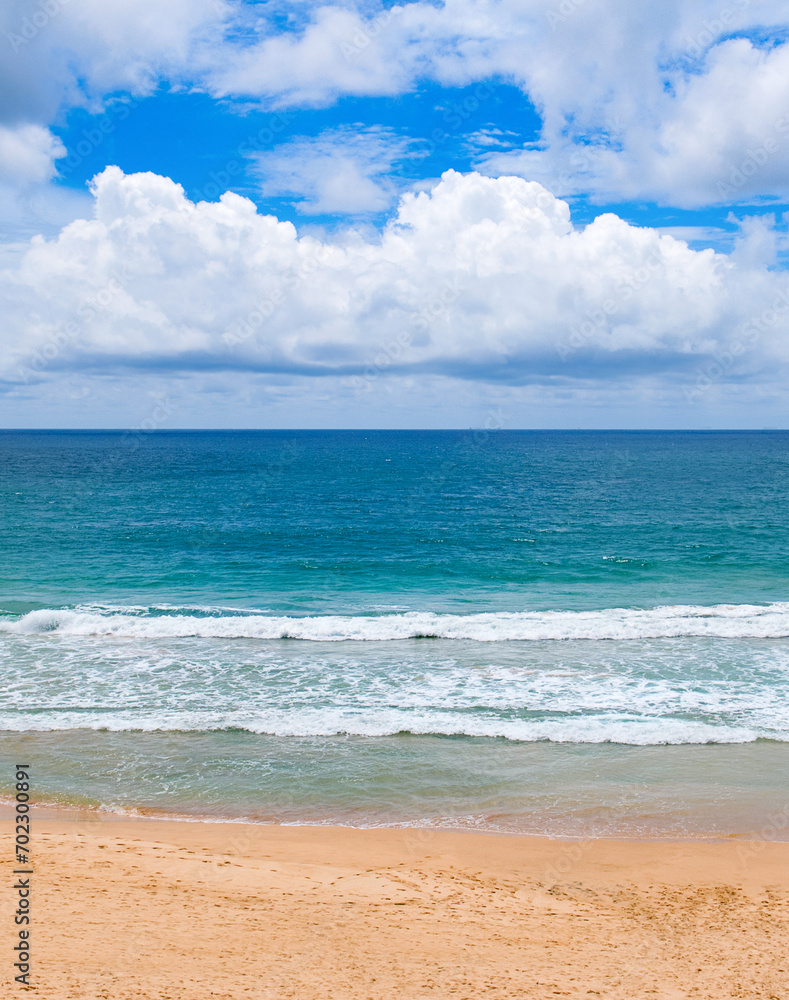 Sea tropical beach and cloudy sky. Vertical photo.