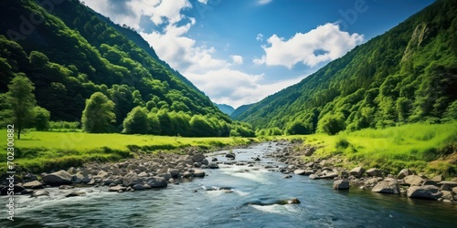 Flowing River Amidst Picturesque Green Mountains
