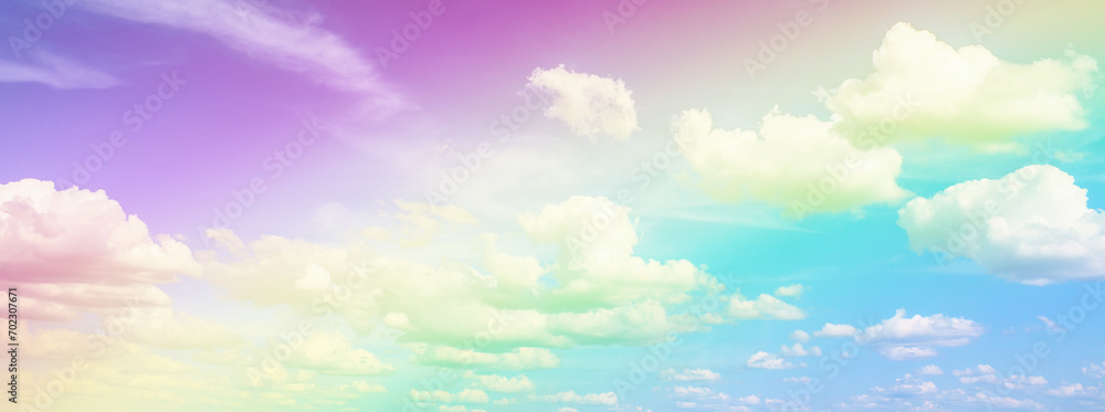 Beautiful rainbow pastel color with clouds and blue sky