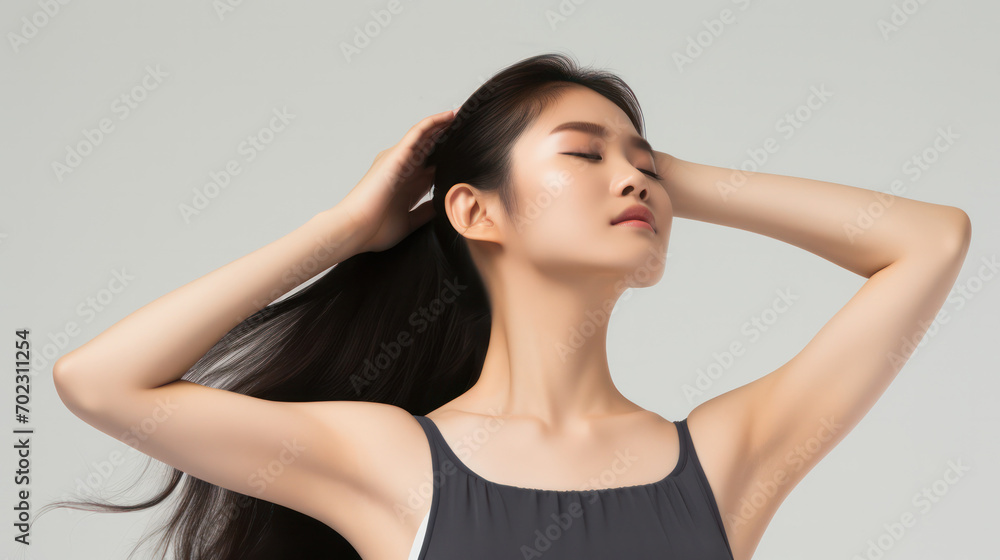 Chic Elegance, Stylish Asian Woman with Long Hair, Waist-Revealing Tank Top, on White Background.