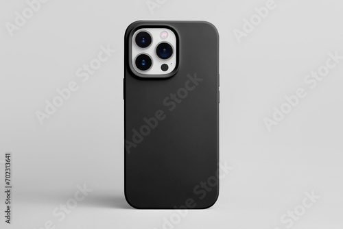 White iPhone 15 Pro in black cover back view isolated on grey background, phone case mock up