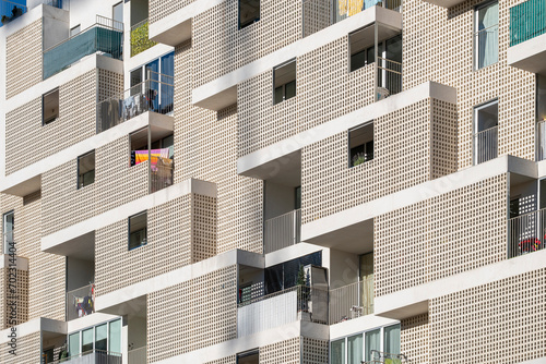 Detail of the white facade of a modern apartment building in the city of Madrid in Spain photo