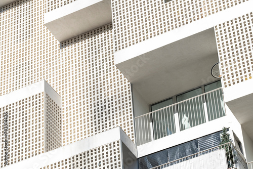 Detail of the white facade of a modern apartment building in the city of Madrid in Spain photo
