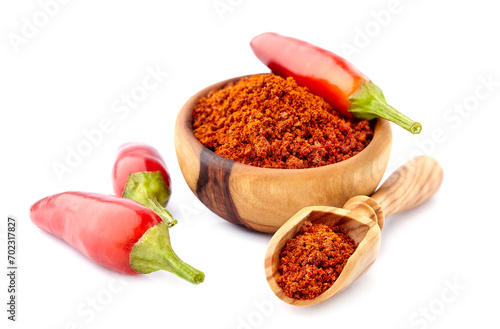 Chilli pepper on white background. Chilli for Jalapeno hot sauce. Mexican cuisine. Dried spice in wooden bowl.