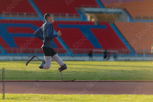 Athletes with disabilities who utilize running blades for short distances. Run down the running track.