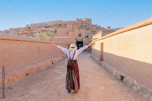Happy tourist with open arms at Ait Ben Haddu Marocco beautiful place to visite in morocco photo