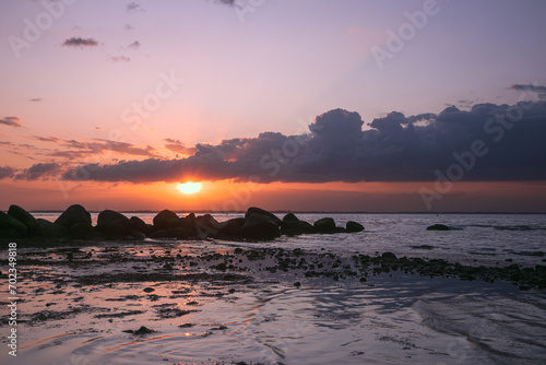 Gorgeous seascape with dramatic sky at sunset. photo