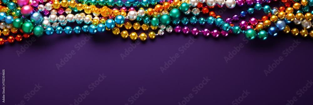 Beads on a purple background, suitable for design with copy space, Mardi Gras celebration. - obrazy, fototapety, plakaty 