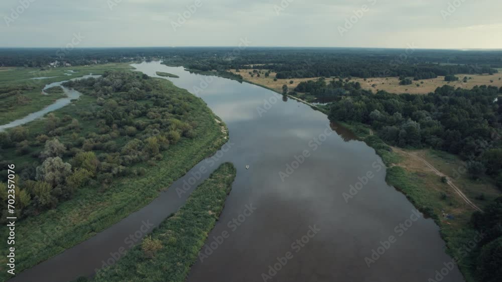 Majestic Sunset: Picturesque Forest and the Serene Bug River in Mazovian Village, Masovian Voivodeship, Poland. Drone view
Majestic Sunset: Picturesque Forest and the Serene Bug River in Mazovian Village, Masovian Voivodeship, Poland. Drone view
