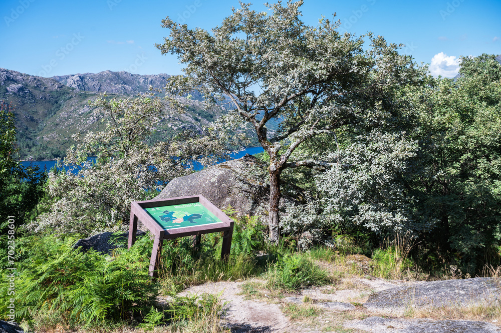 Sign near view point in Peneda Geres National Park, North Portugal, view of the mountains, rivers and trees, selective focus Sign near view point in Peneda Geres National Park, North Portugal, view of the mountains, rivers and trees, selective focus