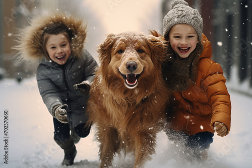 Children and golden dog joyfully playing in winter snow