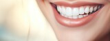 Beautiful female smile after teeth whitening procedure on light background. Dental care. Dentistry concept. Banner with copy space