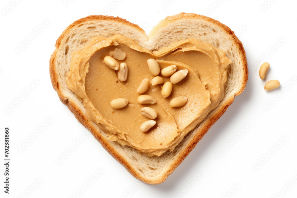 Heart shaped bread toast with peanut butter on white background. Top view. Valentines day food concept. Heart shaped bread toast with peanut butter on white background. Top view. Valentines day food concept.