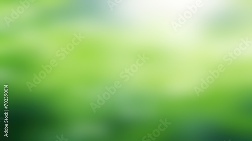 Very blurred green leaves and blurred light bokeh, soft blur abstract background.