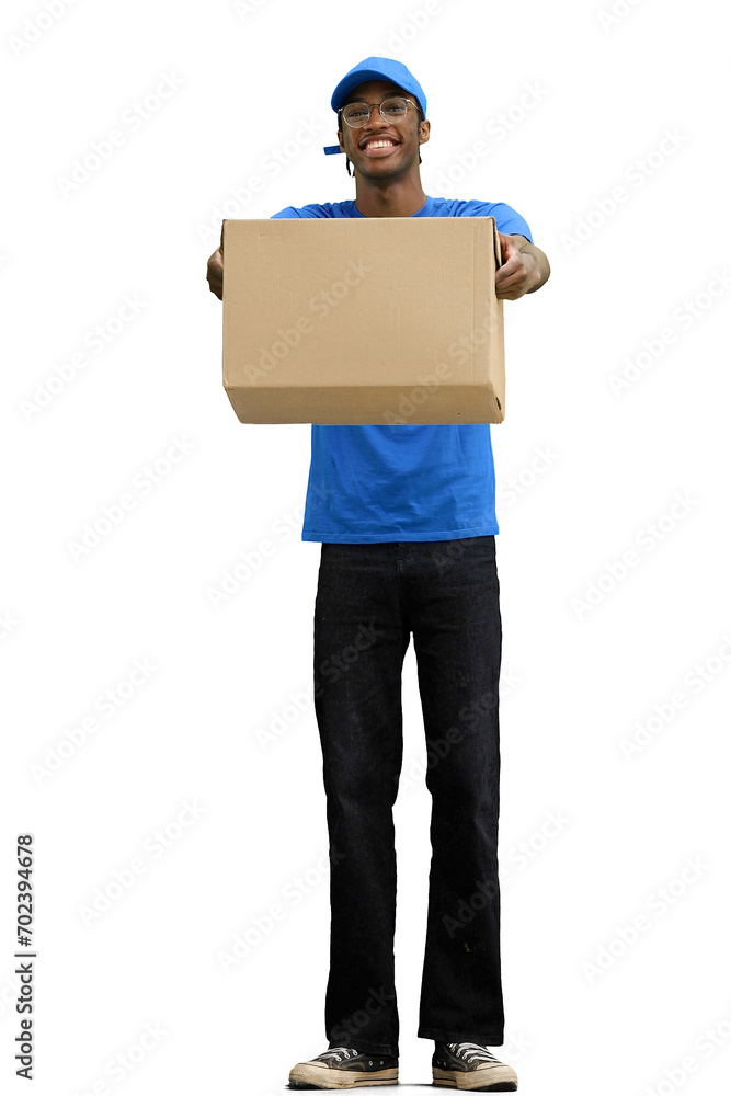 A male deliveryman, on a white background, in full height, gives a box A male deliveryman, on a white background, in full height, gives a box