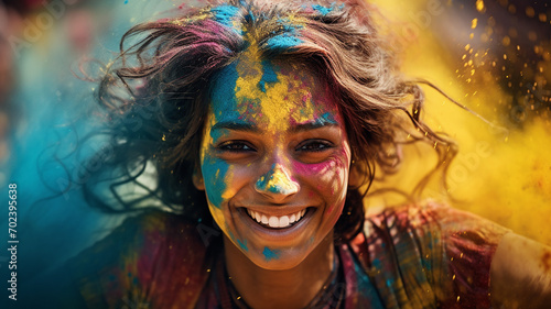 Cheerful young woman covered with colored powder. Holi festival