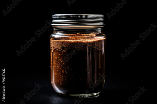 Jar of instant coffee isolated on black