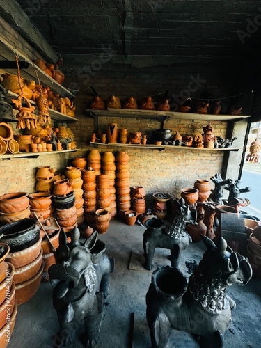 Inside a pottery workshop and shop in Kathmandu, Nepal, where various clay creations, including animals and pottery items, come to life. © FCEalin 